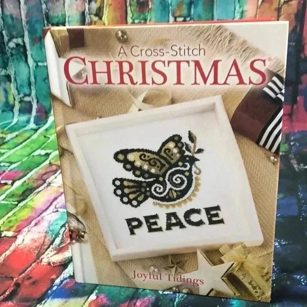 A cross stitch Christmas joyful tidings hard‎ back book